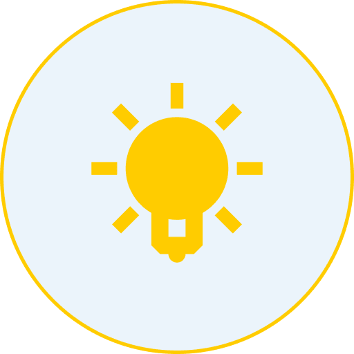 A yellow light bulb icon with rays emanating outward, symbolizing an idea or inspiration, on a light gray background within a circular border.