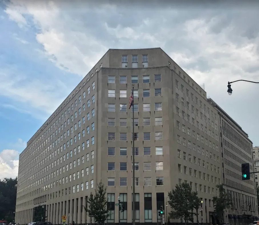 A large building with many windows on the outside.