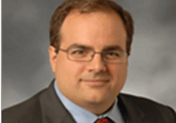 image (5375d8b8-b8e2-48db-88fe-acbe9541f8f6) A man in a suit and tie.
